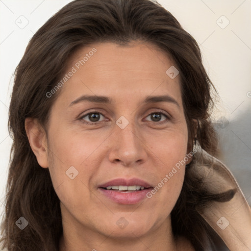 Joyful white adult female with long  brown hair and brown eyes