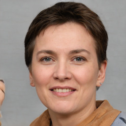 Joyful white adult female with short  brown hair and brown eyes