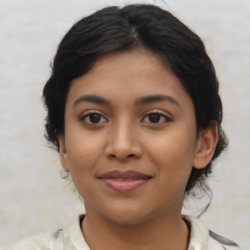 Joyful latino young-adult female with medium  black hair and brown eyes