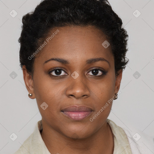 Joyful black young-adult female with short  brown hair and brown eyes