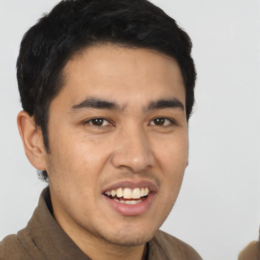 Joyful asian young-adult male with short  brown hair and brown eyes