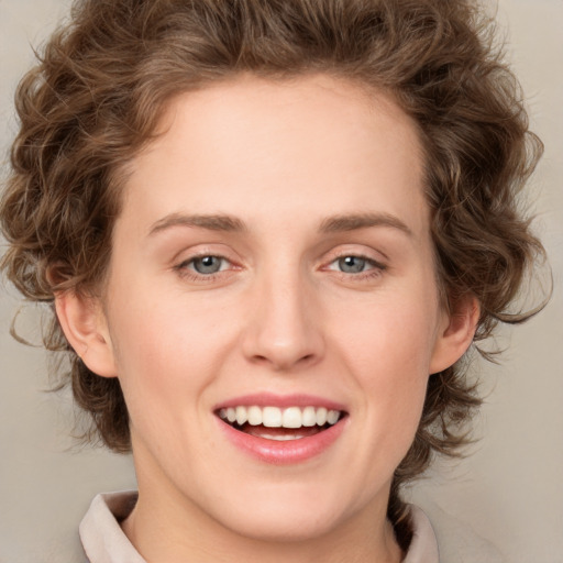 Joyful white young-adult female with medium  brown hair and green eyes