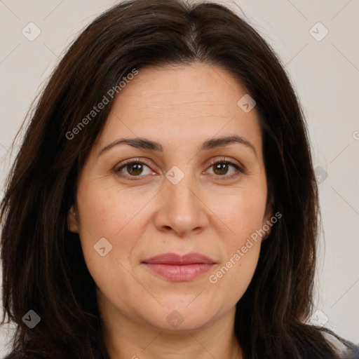 Joyful white adult female with long  brown hair and brown eyes