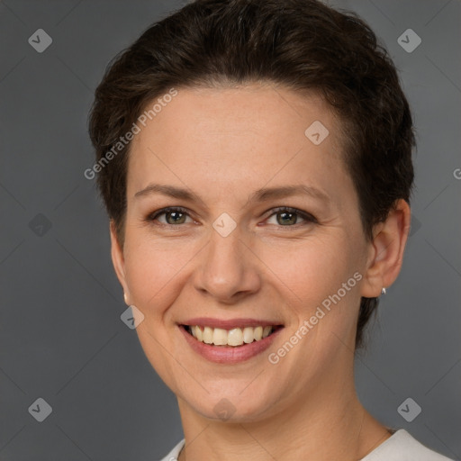 Joyful white adult female with short  brown hair and brown eyes