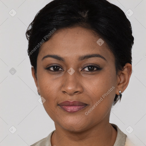 Joyful black young-adult female with short  black hair and brown eyes