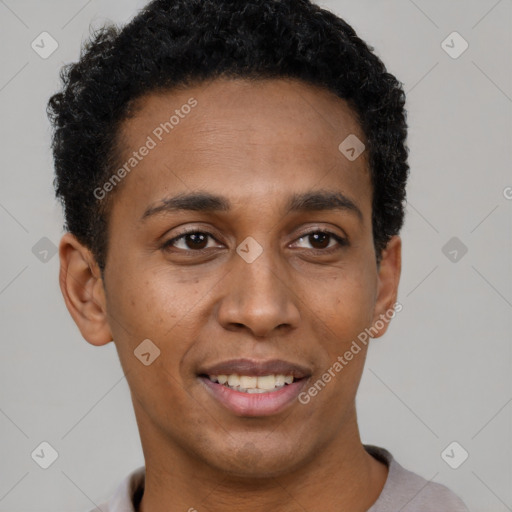 Joyful black young-adult male with short  black hair and brown eyes