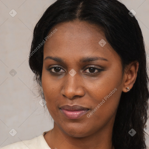 Joyful black young-adult female with medium  brown hair and brown eyes