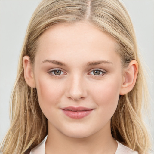 Joyful white young-adult female with long  brown hair and blue eyes