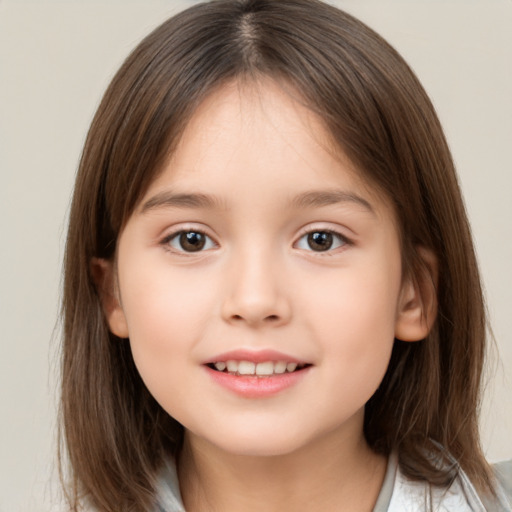 Joyful white child female with medium  brown hair and brown eyes