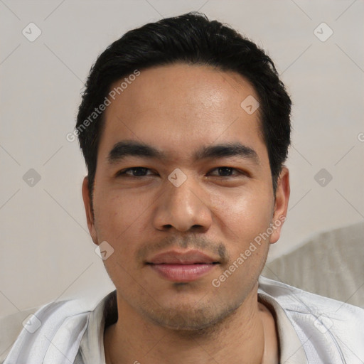 Joyful asian young-adult male with short  black hair and brown eyes