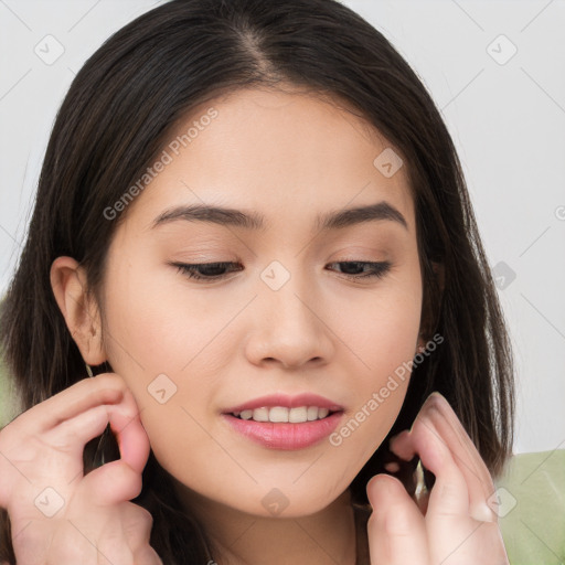 Joyful white young-adult female with long  brown hair and brown eyes