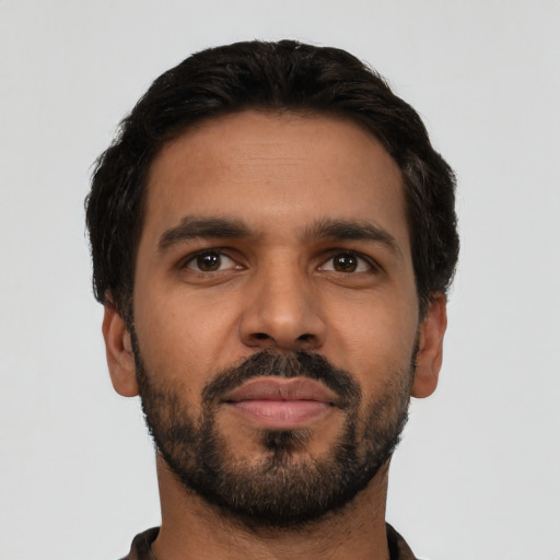 Neutral latino young-adult male with short  black hair and brown eyes