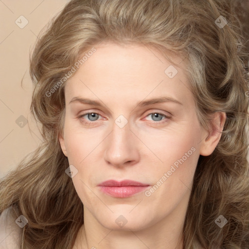 Joyful white young-adult female with long  brown hair and green eyes