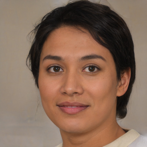 Joyful asian young-adult female with medium  brown hair and brown eyes