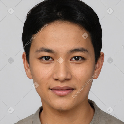 Joyful asian young-adult male with short  black hair and brown eyes