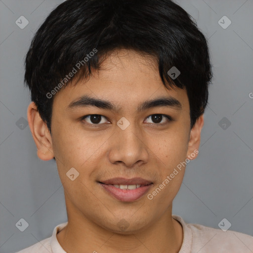 Joyful asian young-adult male with short  brown hair and brown eyes