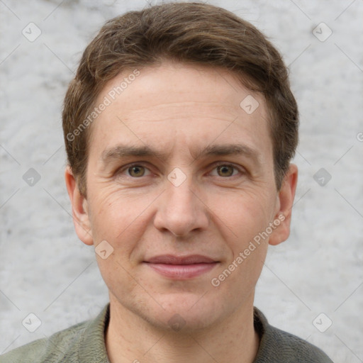 Joyful white adult male with short  brown hair and grey eyes