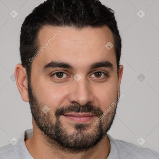 Joyful white young-adult male with short  black hair and brown eyes