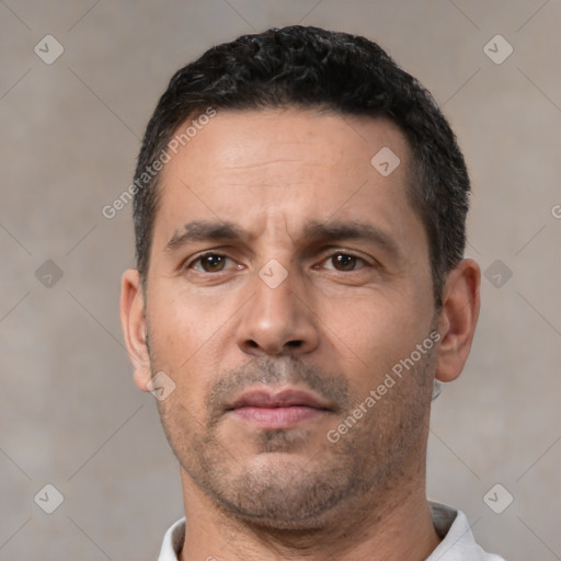 Neutral white adult male with short  black hair and brown eyes
