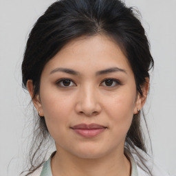 Joyful asian young-adult female with medium  brown hair and brown eyes