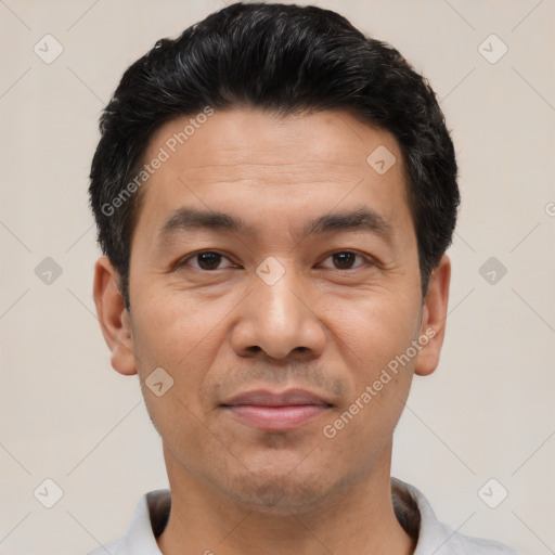 Joyful white young-adult male with short  black hair and brown eyes