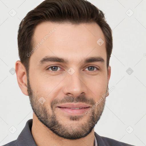 Joyful white young-adult male with short  brown hair and brown eyes