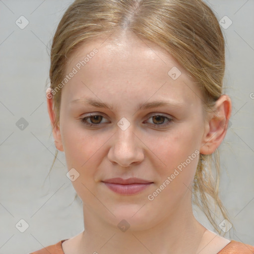 Joyful white child female with medium  brown hair and brown eyes