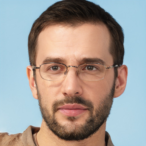 Joyful white adult male with short  brown hair and brown eyes