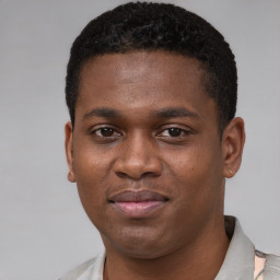 Joyful latino young-adult male with short  brown hair and brown eyes