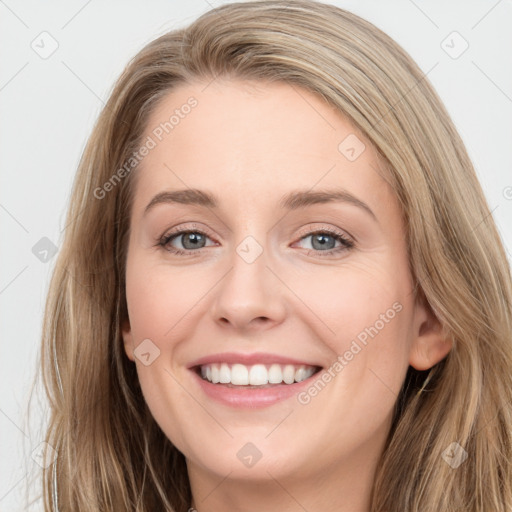 Joyful white young-adult female with long  brown hair and grey eyes