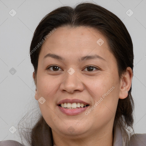 Joyful white adult female with medium  brown hair and brown eyes