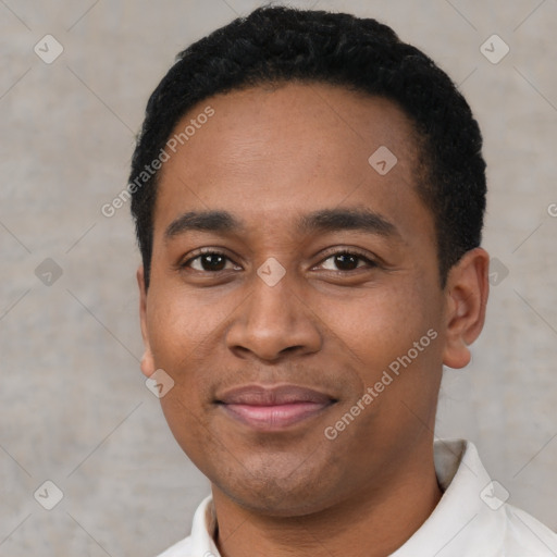 Joyful latino young-adult male with short  black hair and brown eyes