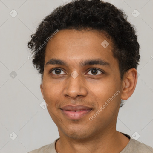 Joyful black young-adult male with short  brown hair and brown eyes