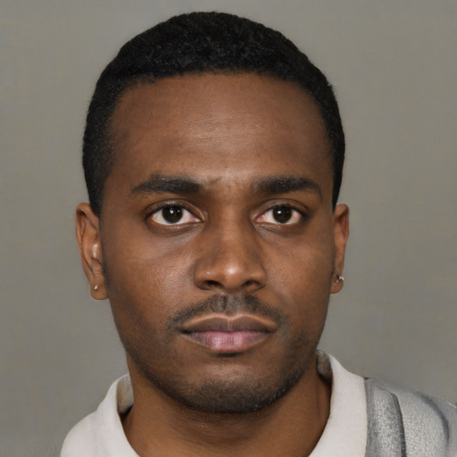 Neutral black young-adult male with short  black hair and brown eyes