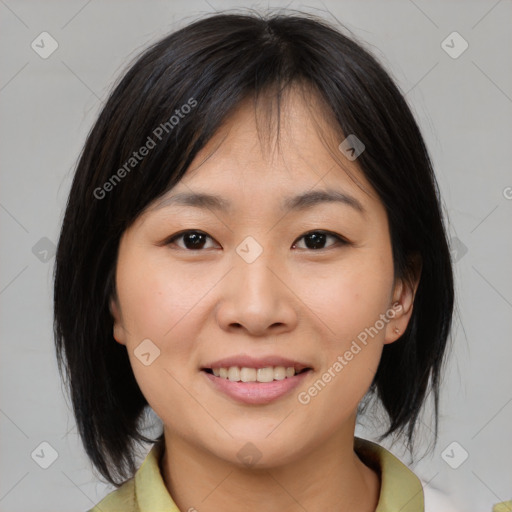 Joyful asian young-adult female with medium  brown hair and brown eyes