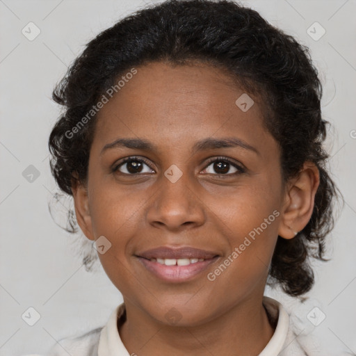 Joyful black young-adult female with short  brown hair and brown eyes