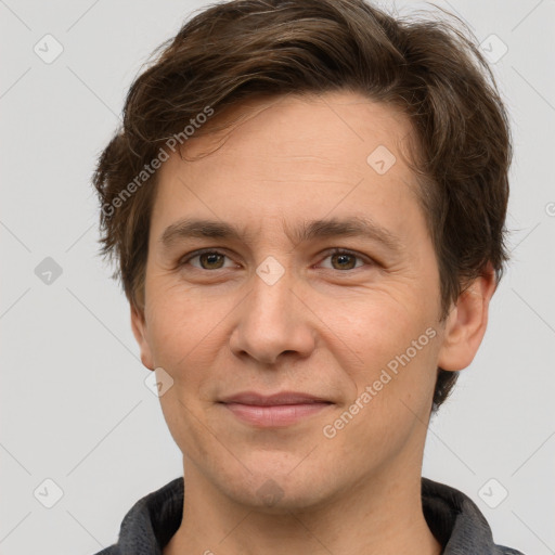 Joyful white adult male with short  brown hair and grey eyes