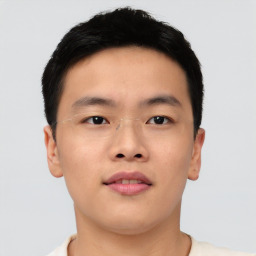 Neutral asian young-adult male with short  brown hair and brown eyes