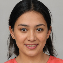 Joyful white young-adult female with medium  brown hair and brown eyes