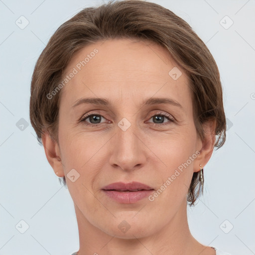 Joyful white adult female with medium  brown hair and grey eyes