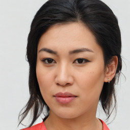 Joyful asian young-adult female with medium  brown hair and brown eyes