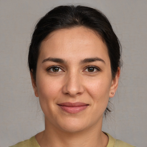 Joyful white young-adult female with medium  brown hair and brown eyes