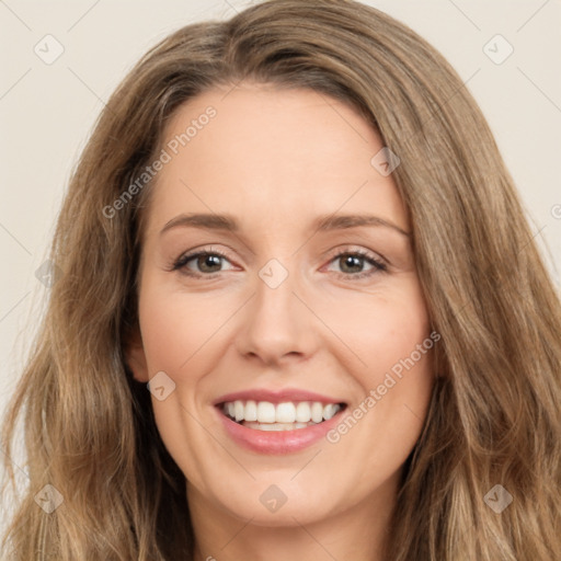 Joyful white young-adult female with long  brown hair and brown eyes