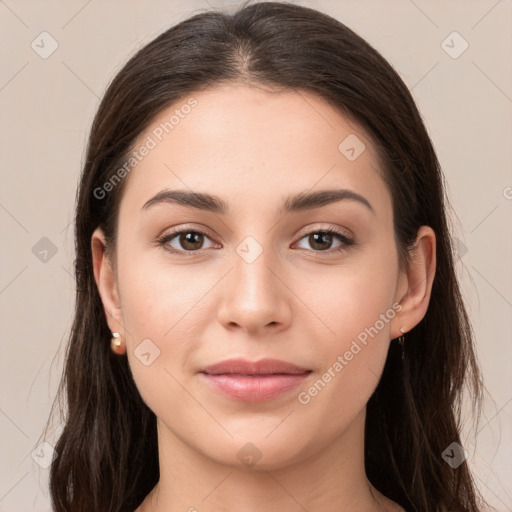 Joyful white young-adult female with long  brown hair and brown eyes