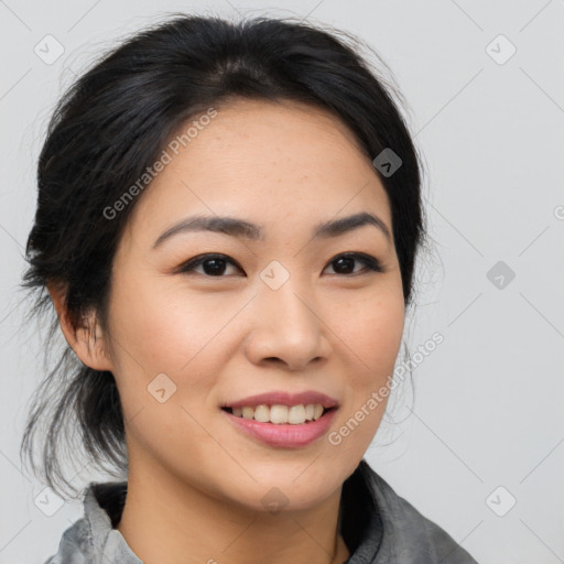 Joyful asian young-adult female with medium  black hair and brown eyes