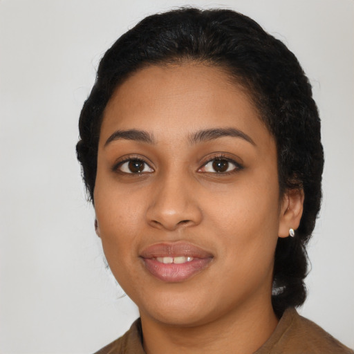 Joyful latino young-adult female with medium  black hair and brown eyes