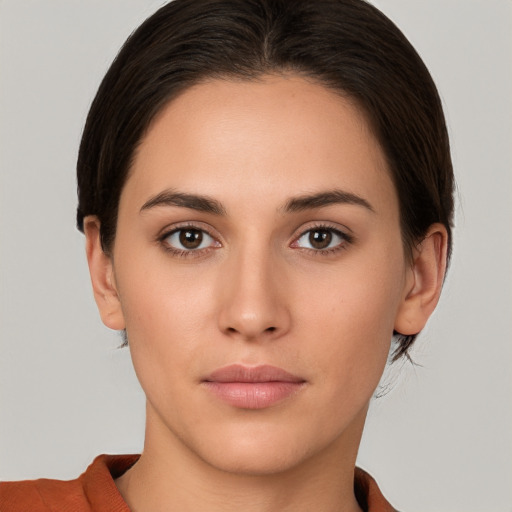 Neutral white young-adult female with short  brown hair and brown eyes