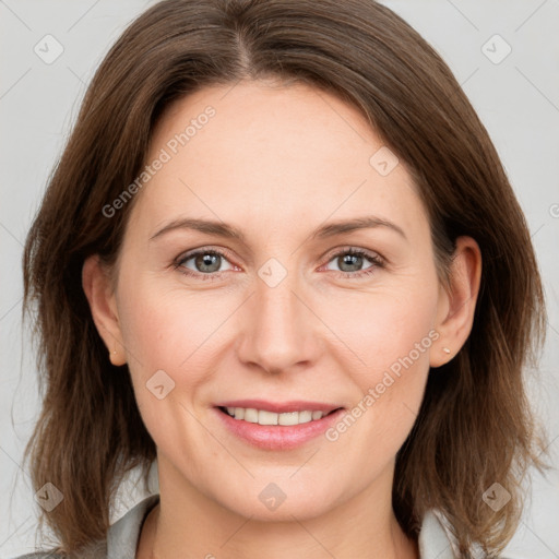 Joyful white adult female with medium  brown hair and grey eyes