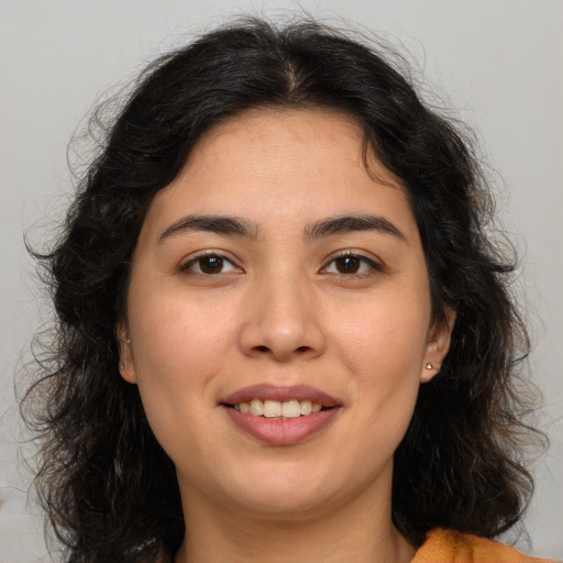 Joyful asian young-adult female with long  brown hair and brown eyes