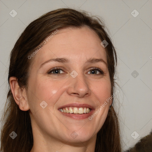 Joyful white young-adult female with medium  brown hair and blue eyes